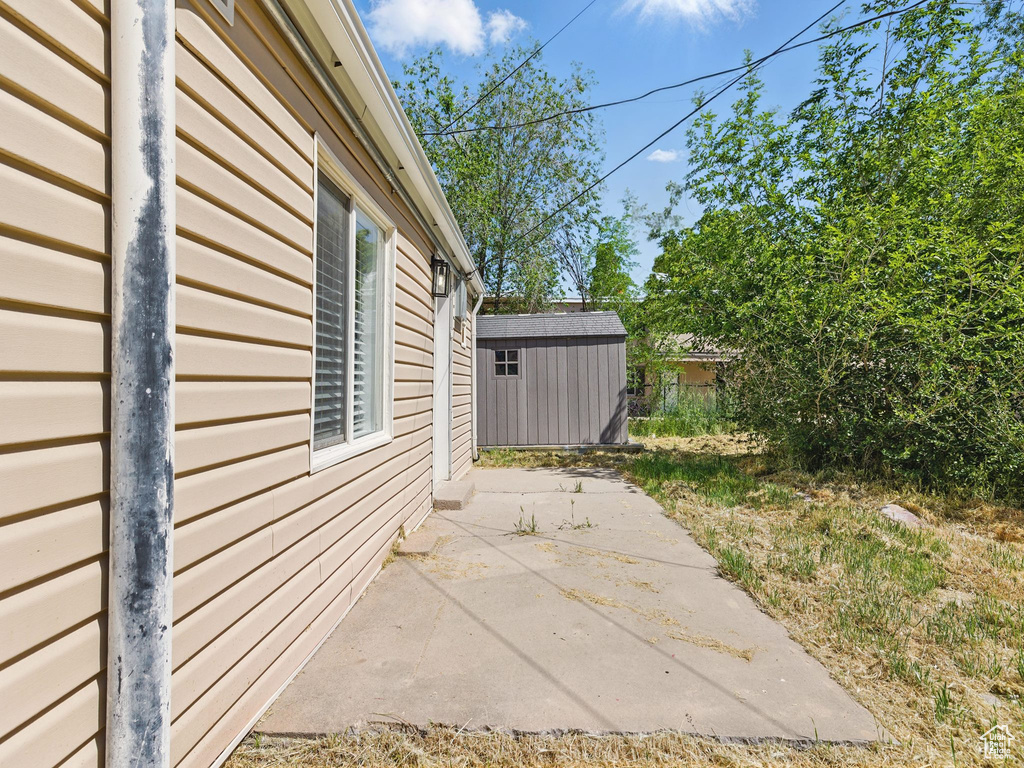 View of side of home featuring a patio
