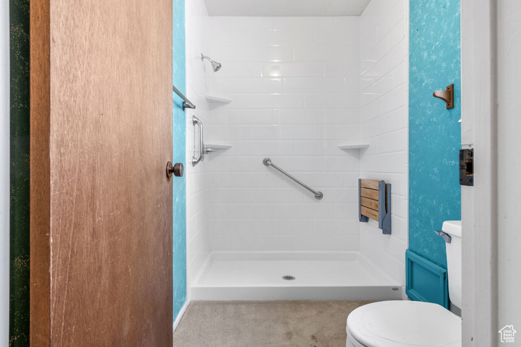Bathroom with toilet and a shower stall