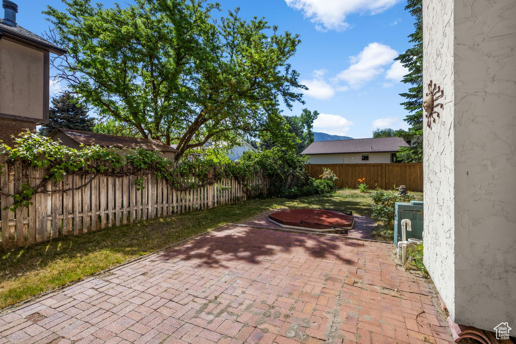 Fenced backyard with a patio