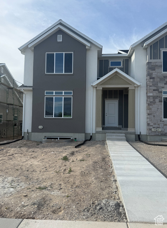 View of front of house featuring stucco siding