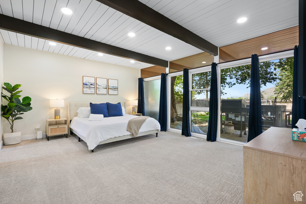 Carpeted bedroom with beam ceiling, recessed lighting, baseboards, and floor to ceiling windows