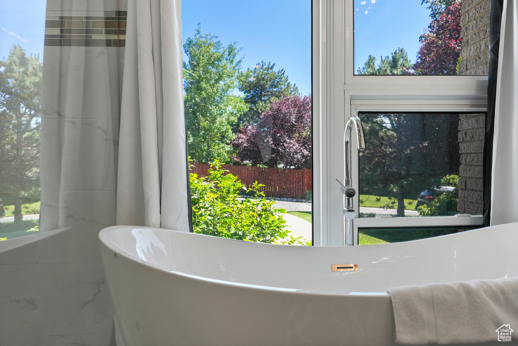 Full bath featuring a freestanding bath