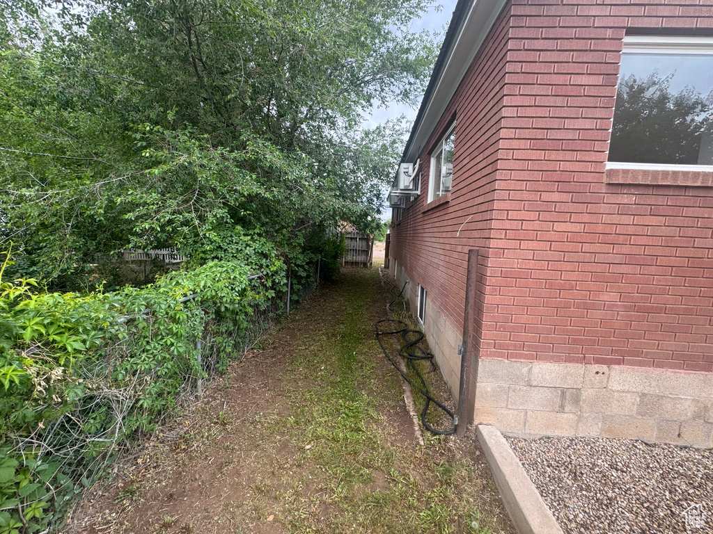 View of side of property with brick siding