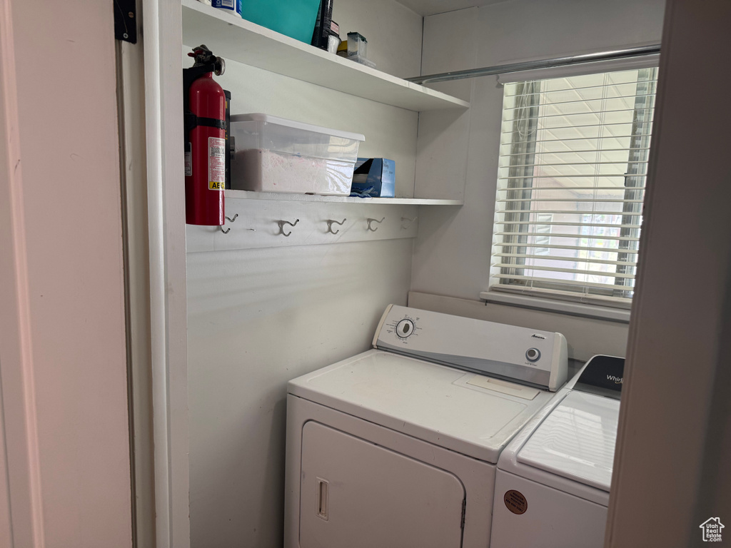Washroom featuring washer and clothes dryer