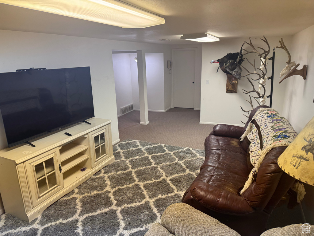 Living area with carpet floors and baseboards