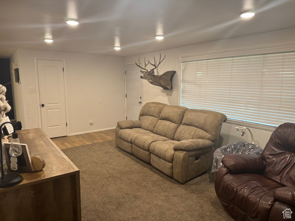Living room with wood finished floors and baseboards