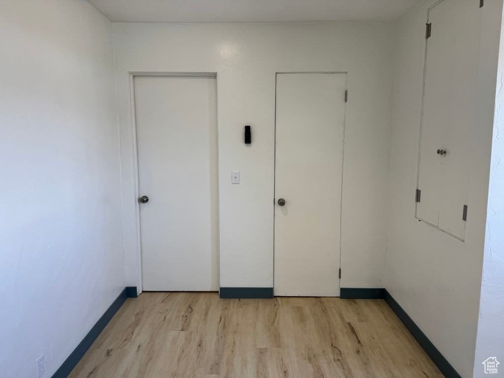 Unfurnished bedroom with light wood-style floors
