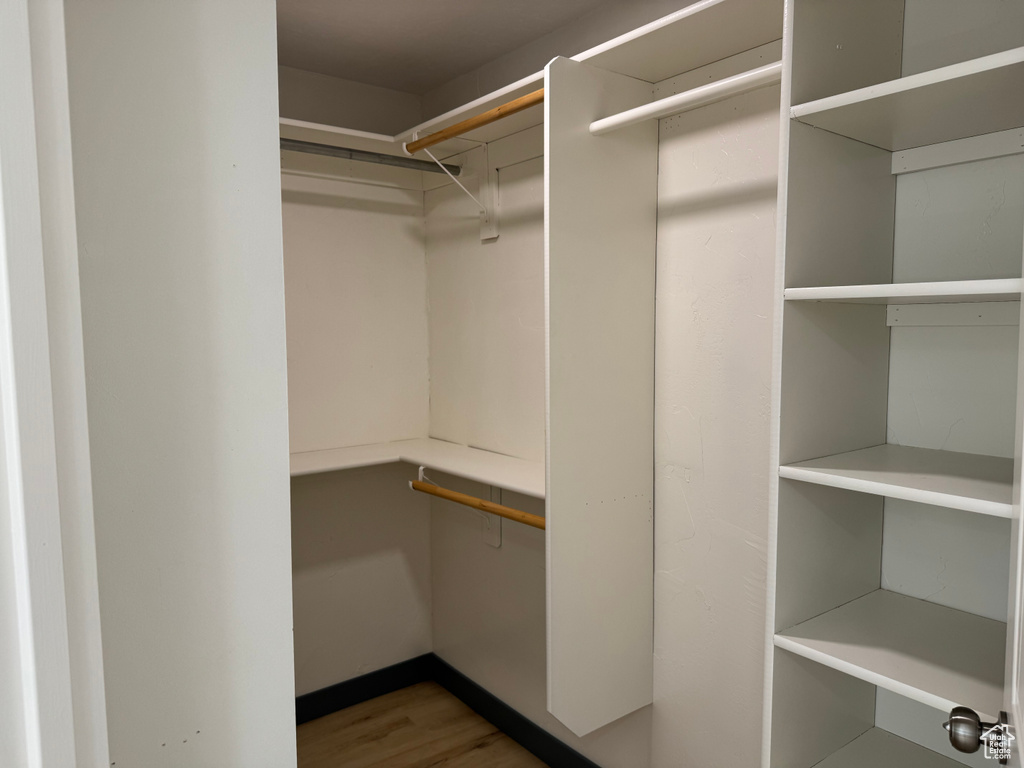 Spacious closet featuring wood finished floors
