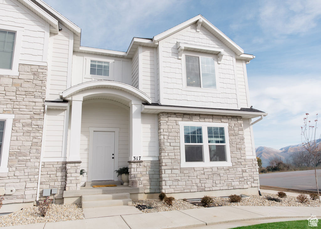View of front of property with stone siding