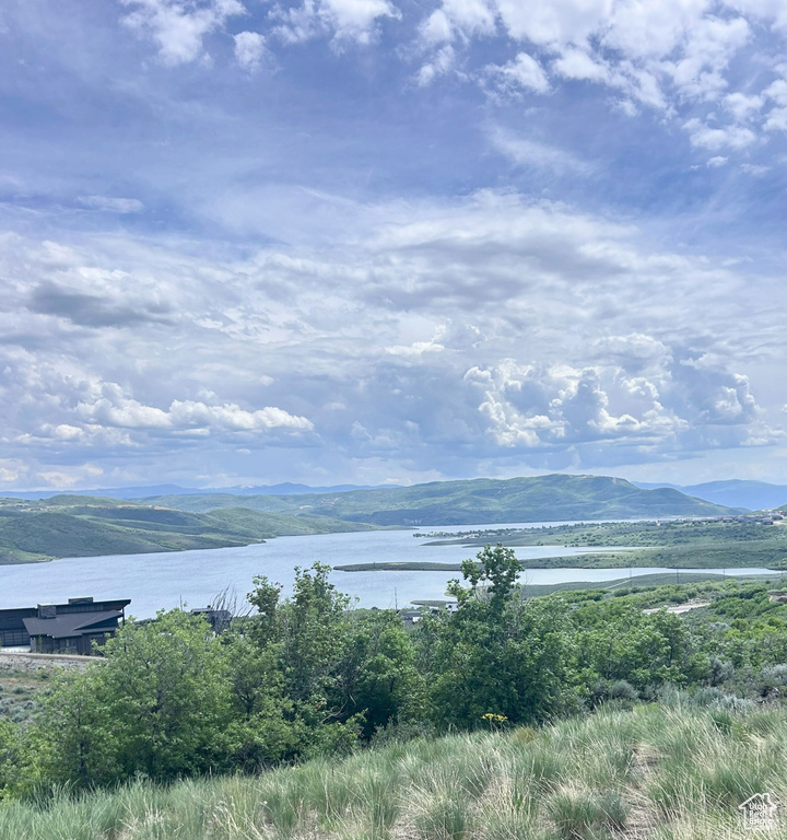 View of mountain background featuring a nearby body of water