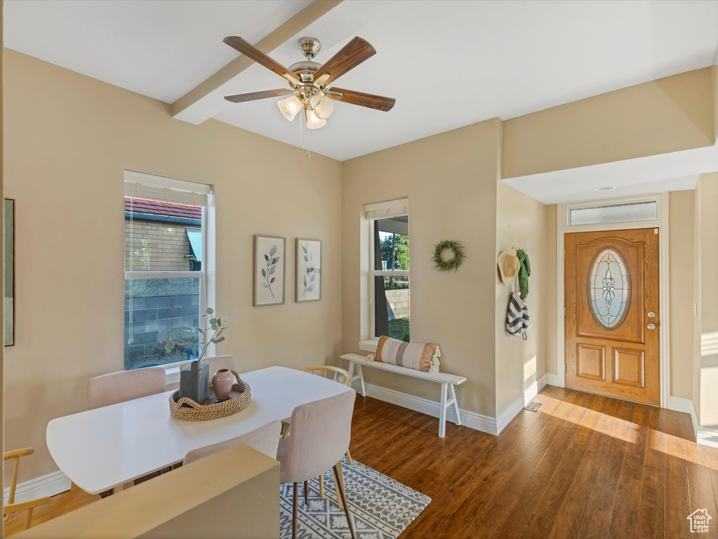 Dining room featuring a ceiling fan, wood finished floors, and baseboards
