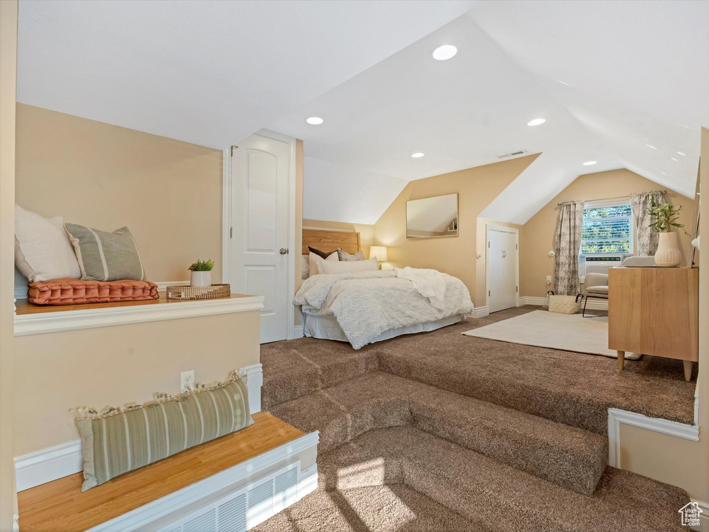 Bedroom with vaulted ceiling, carpet, baseboards, and recessed lighting