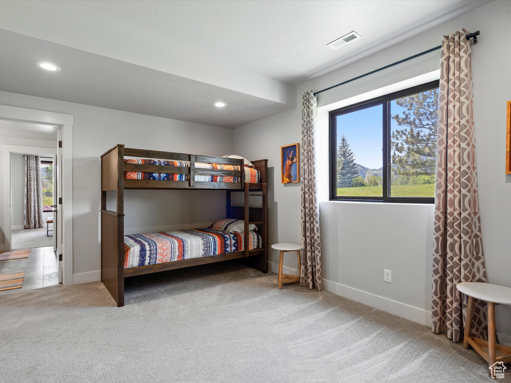 Carpeted bedroom featuring recessed lighting and baseboards