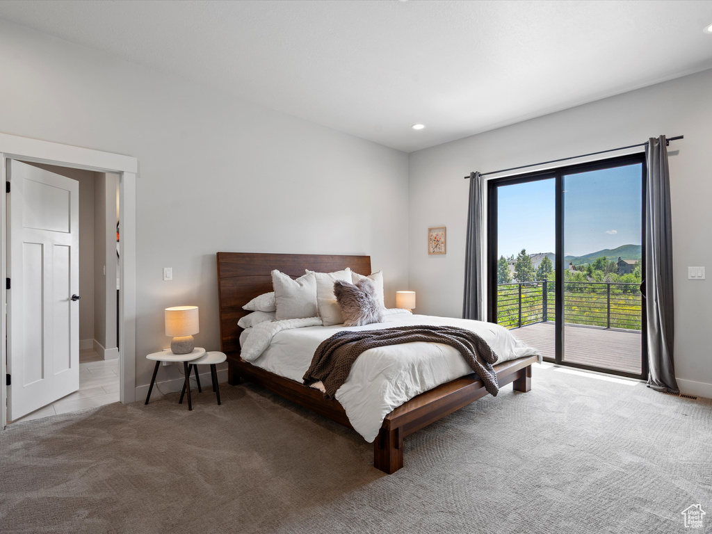 Bedroom with access to outside, carpet floors, baseboards, and recessed lighting
