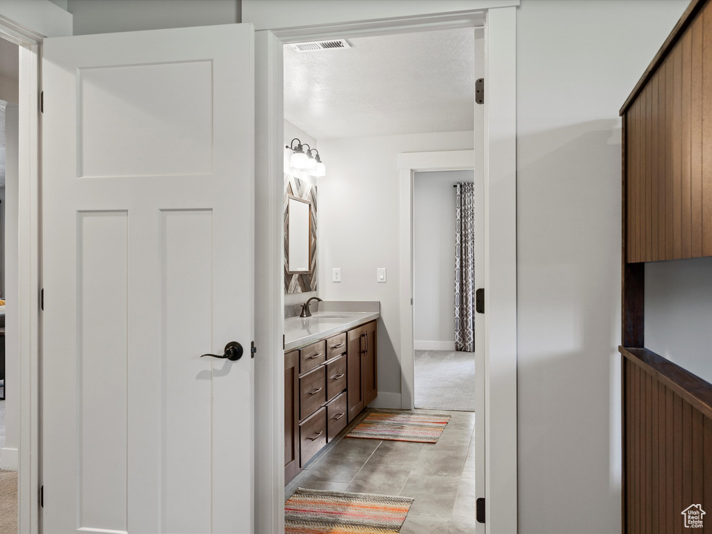 Bathroom with vanity and baseboards