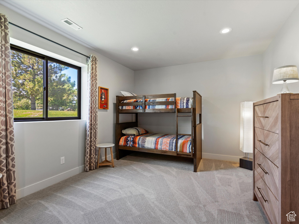Bedroom with carpet, baseboards, and recessed lighting