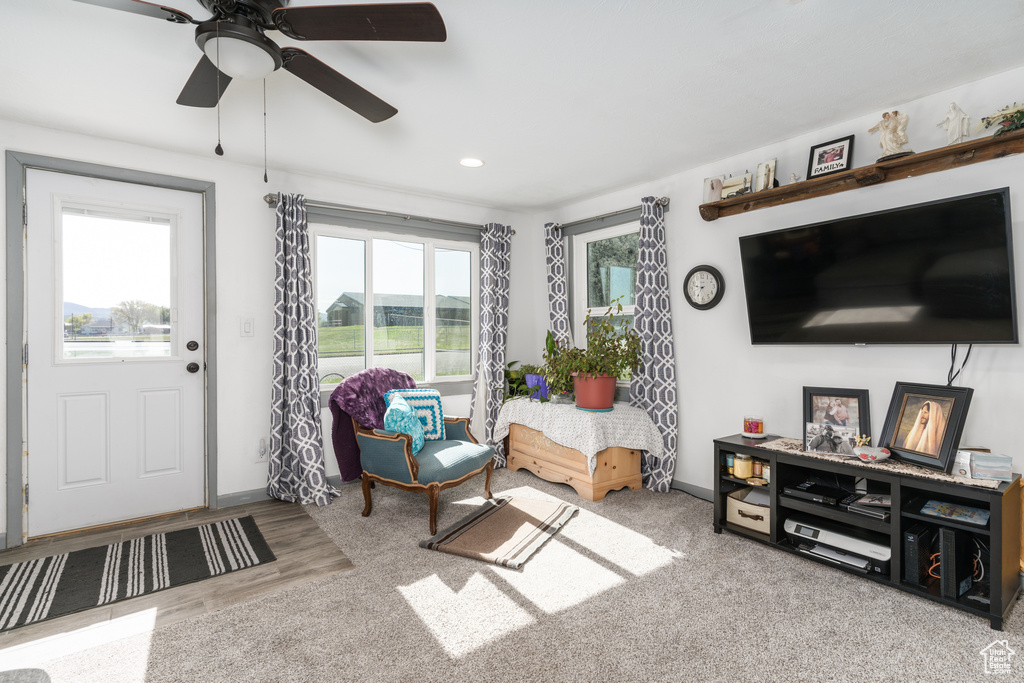 Living room with recessed lighting, baseboards, and a ceiling fan