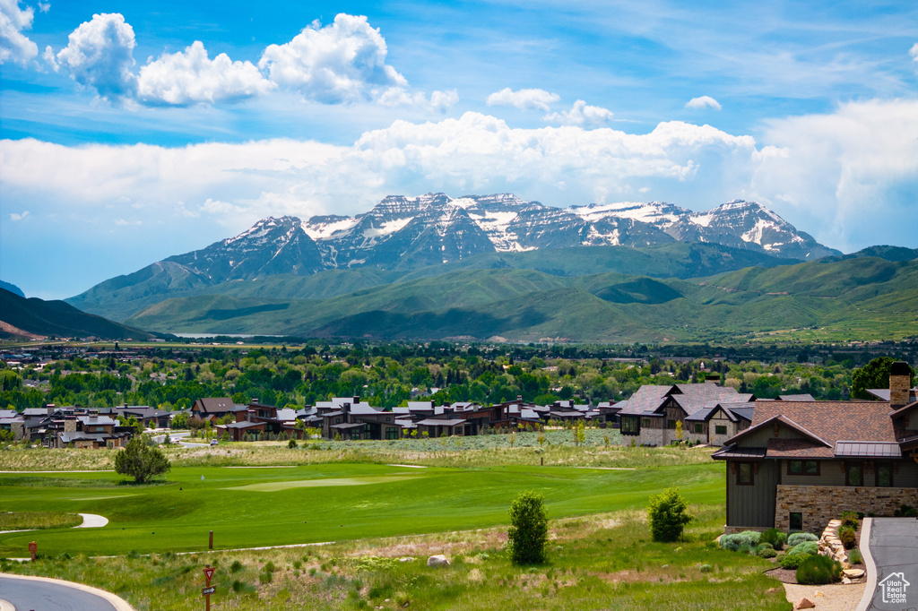 View of mountain background with nearby suburban area and a golf club