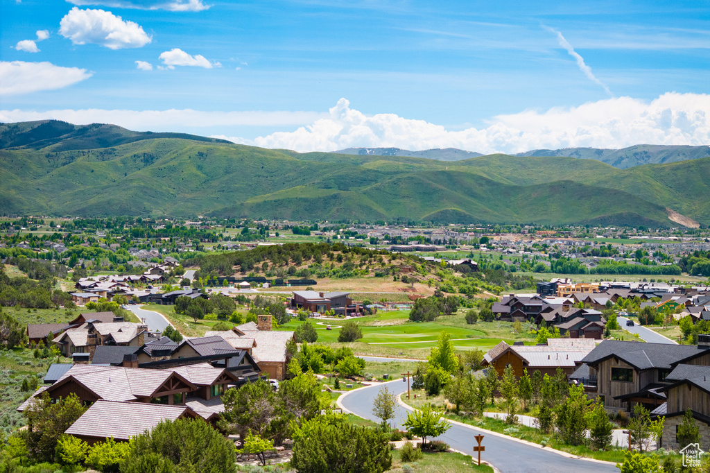 View of mountain backdrop featuring nearby suburban area
