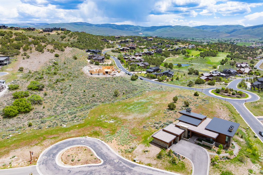 Aerial view of residential area featuring a water and mountain view