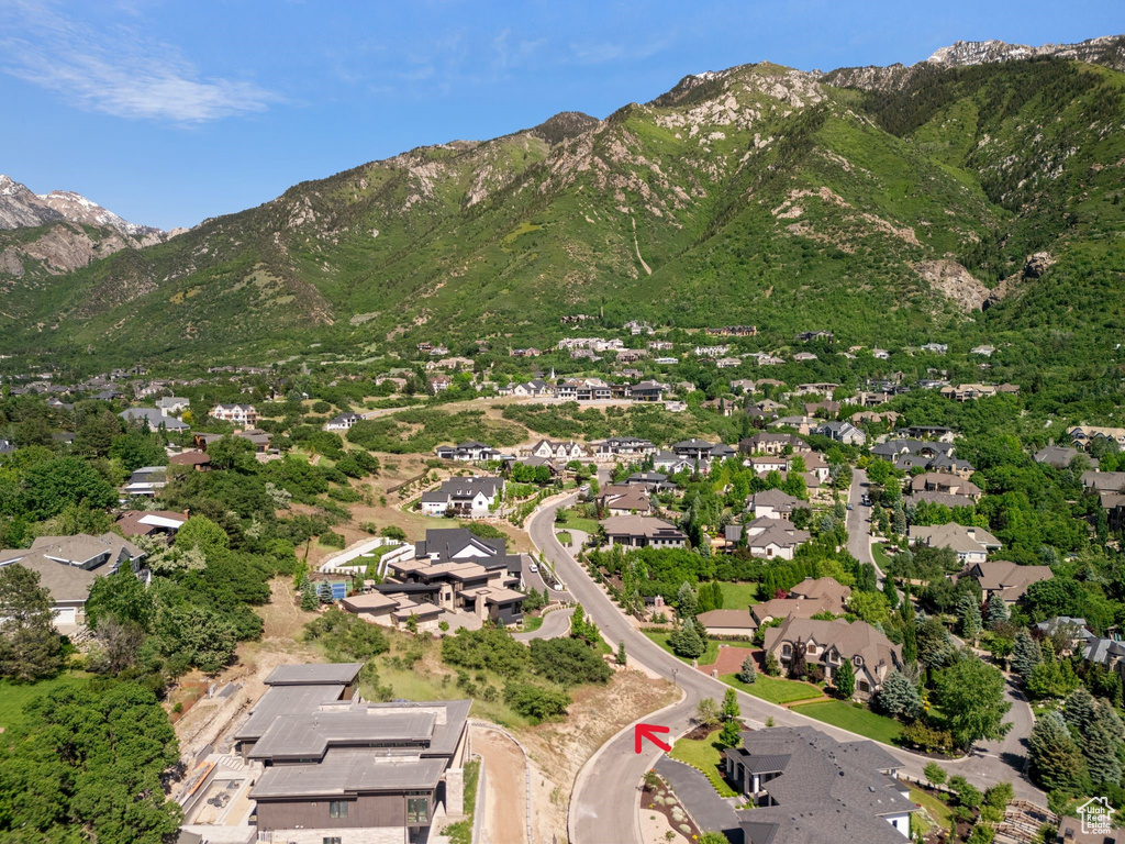 View of property location featuring nearby suburban area and mountains