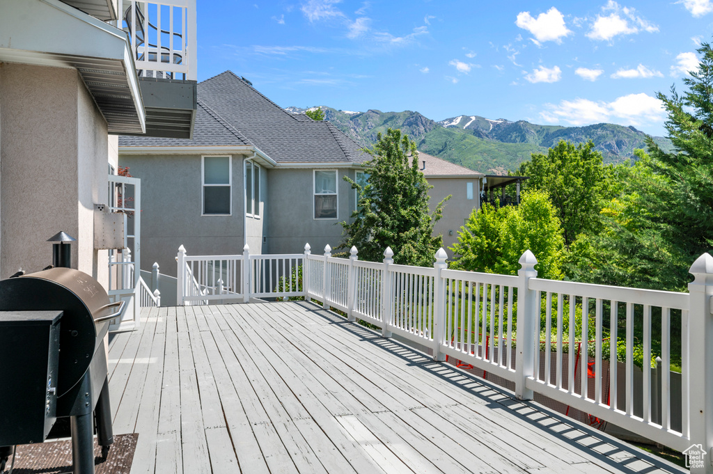 Deck featuring a mountain view and grilling area