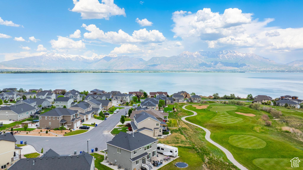 Aerial perspective of suburban area featuring a water and mountain view