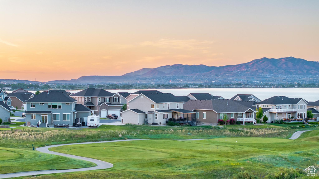 View of mountain background with nearby suburban area and a golf course