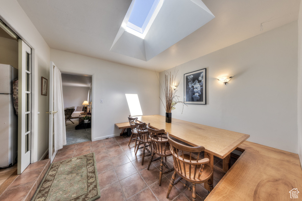 Dining space featuring a skylight