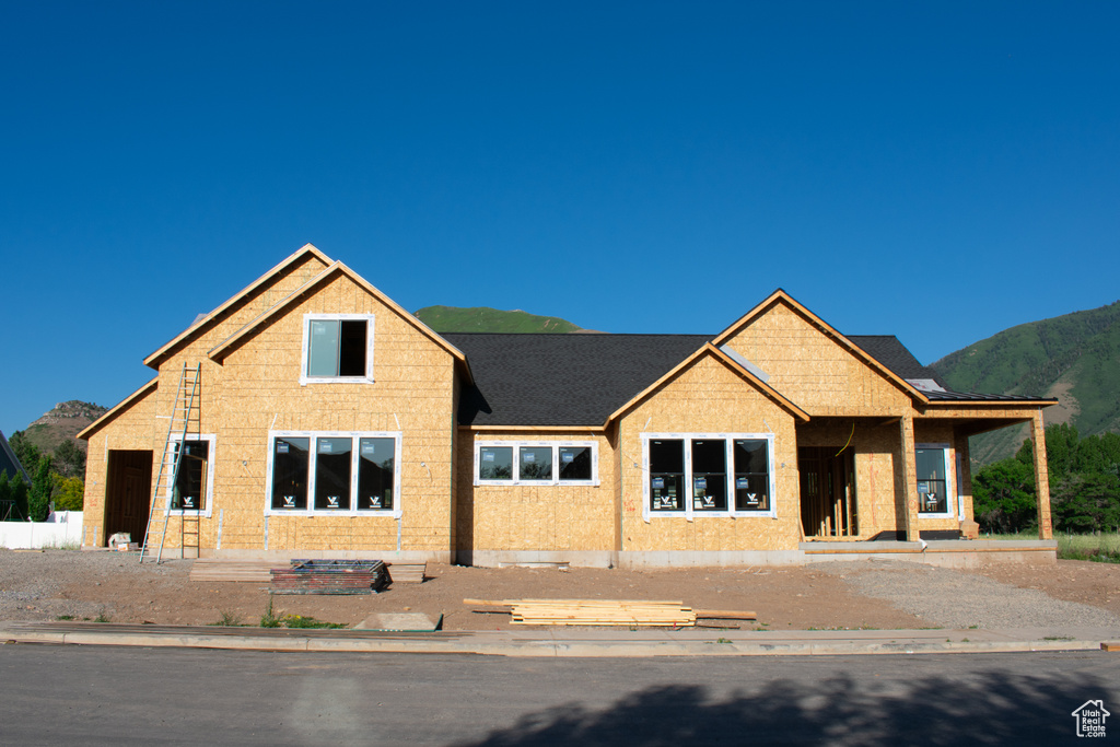 Unfinished property featuring a mountain view