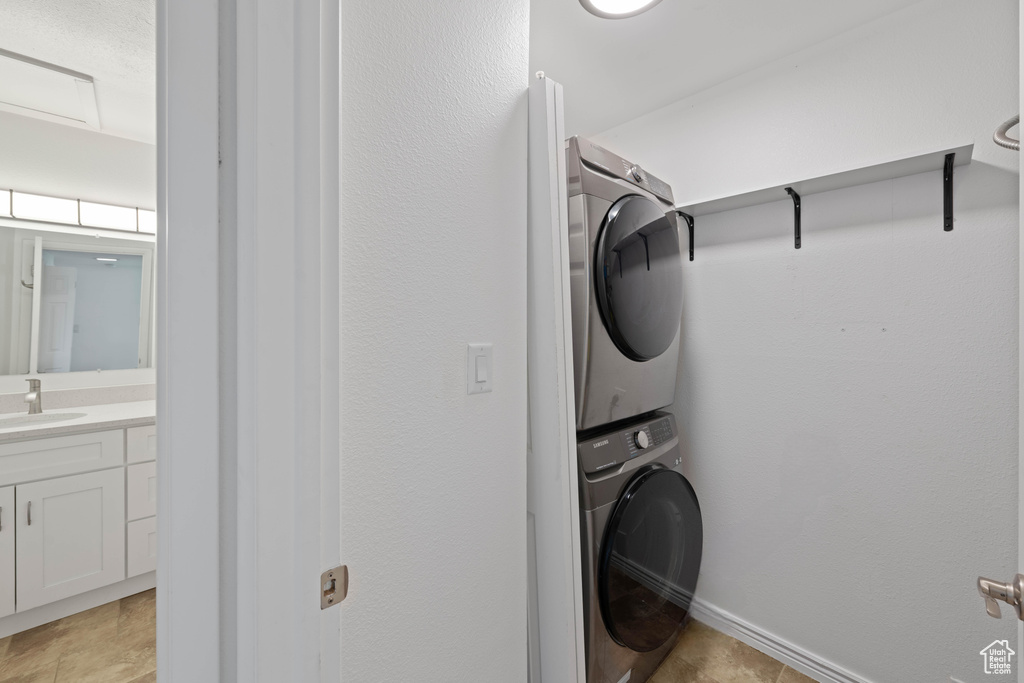 Laundry area featuring stacked washer / dryer