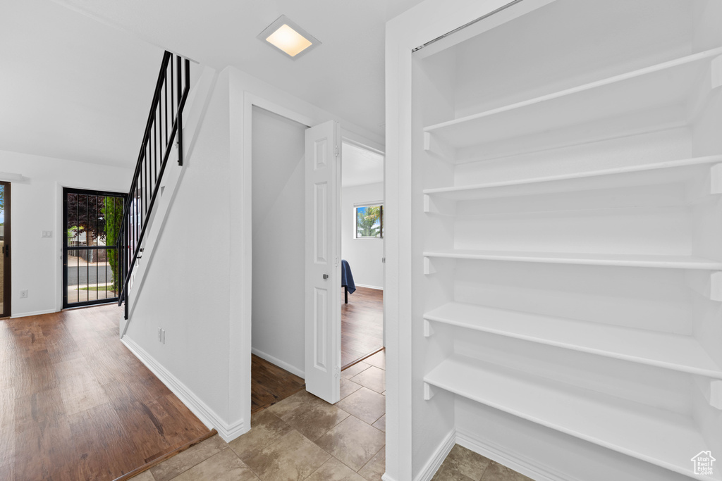 Corridor with stairway and baseboards