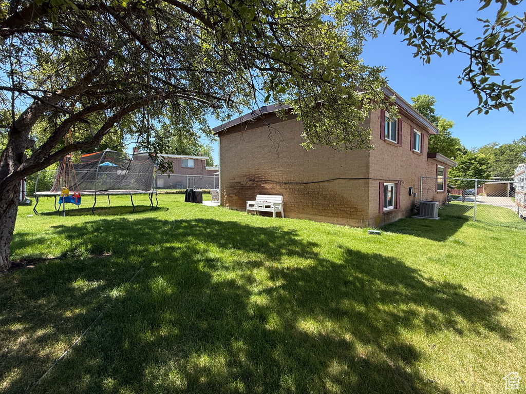 View of yard with a trampoline