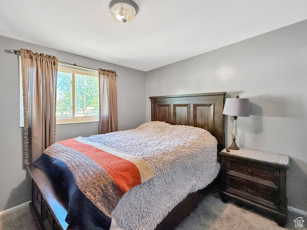 Bedroom with carpet and baseboards