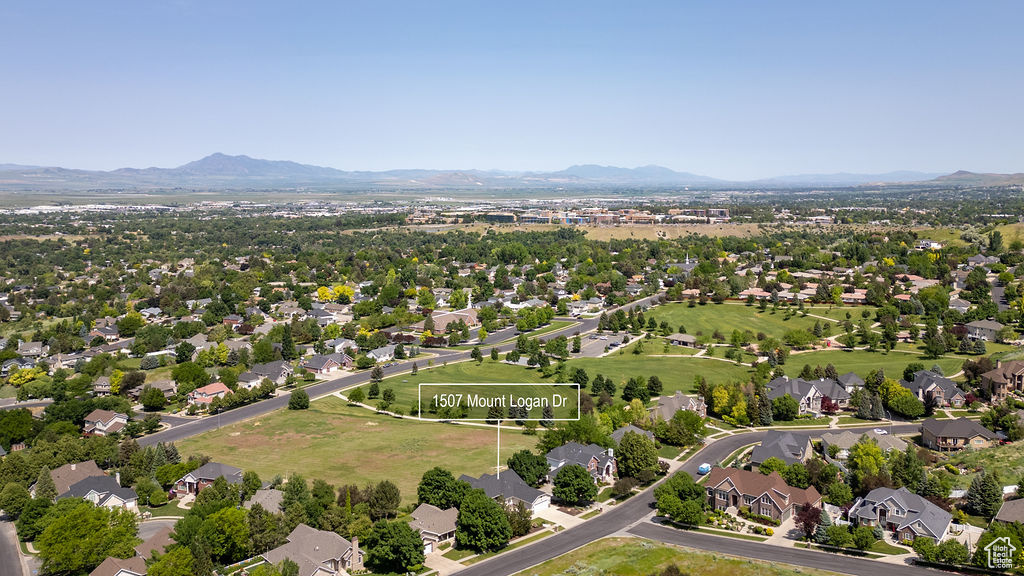 Aerial view of residential area featuring a mountain backdrop