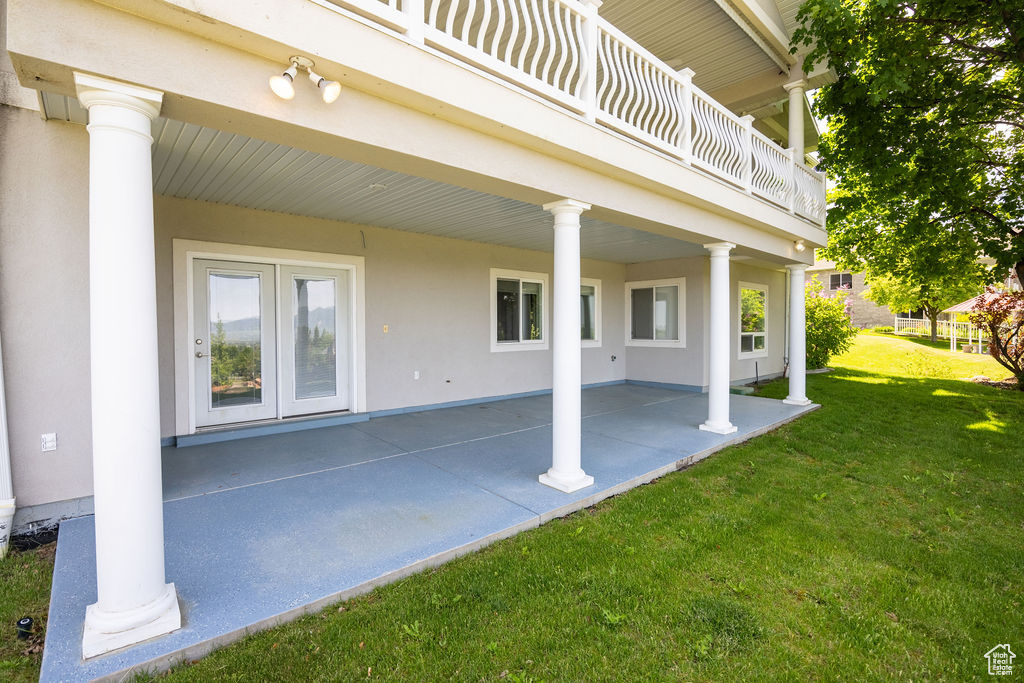 View of patio featuring a balcony
