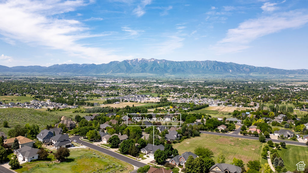 Aerial perspective of suburban area with a mountain backdrop