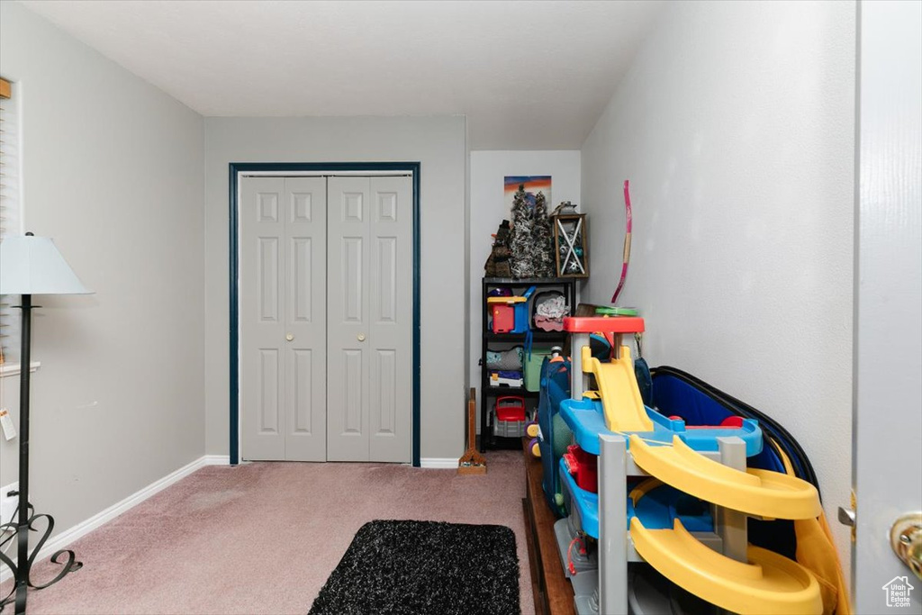 Rec room featuring carpet flooring and baseboards