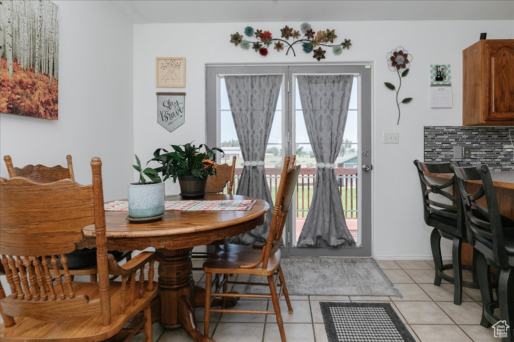 Dining room featuring light tile patterned floors