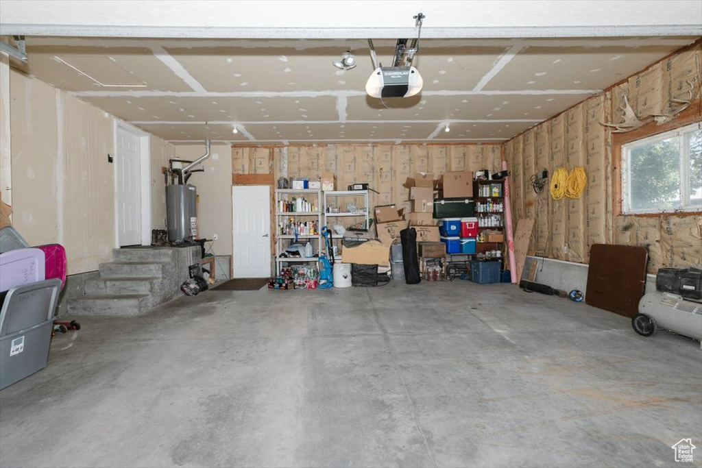 Garage with a garage door opener and gas water heater