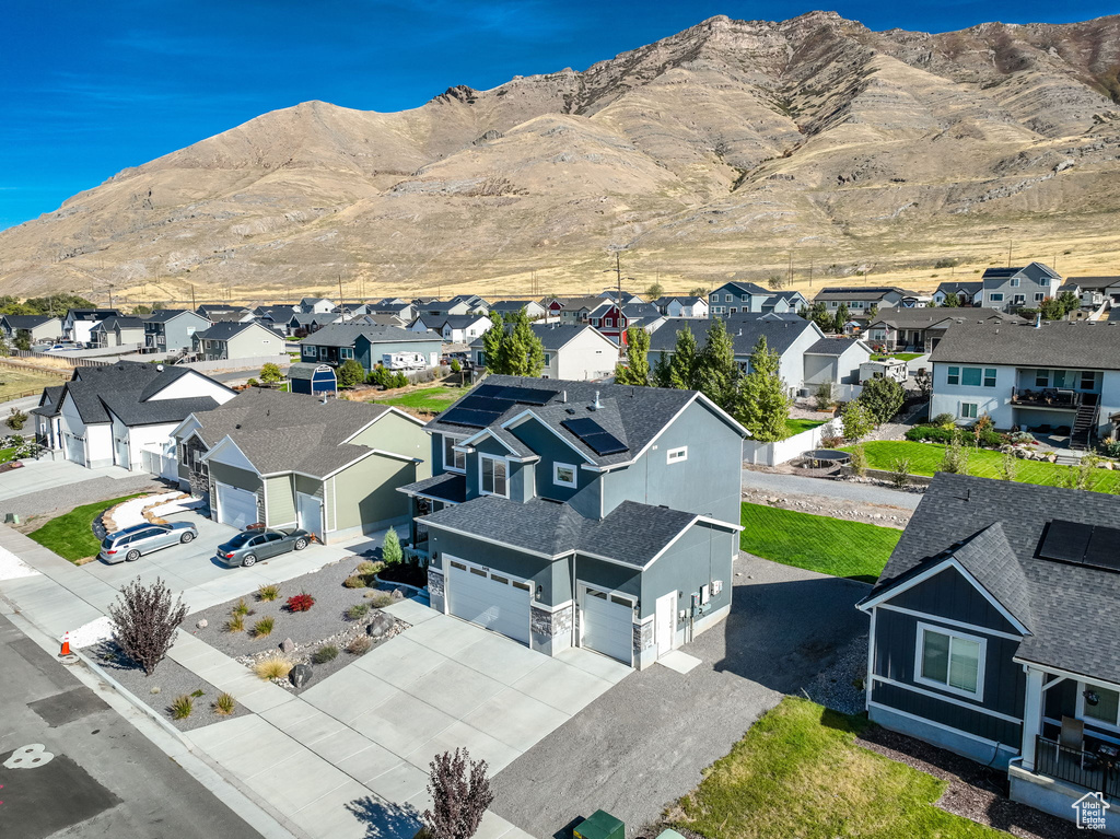 Aerial perspective of suburban area featuring a mountainous background