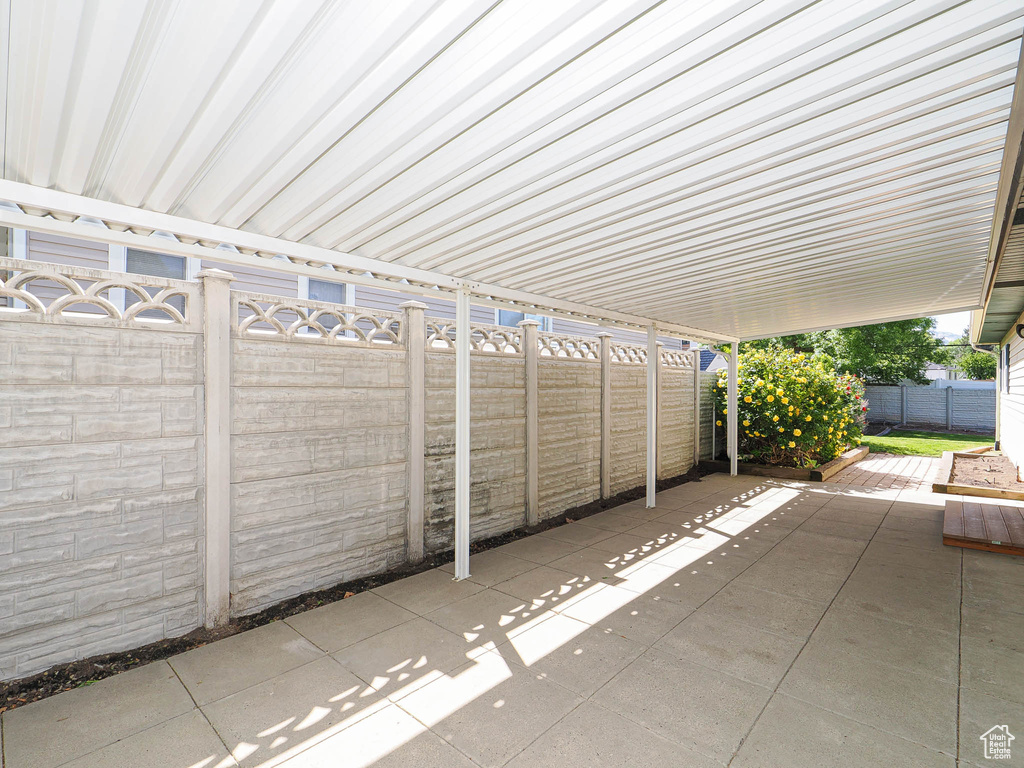 Fenced backyard featuring a patio