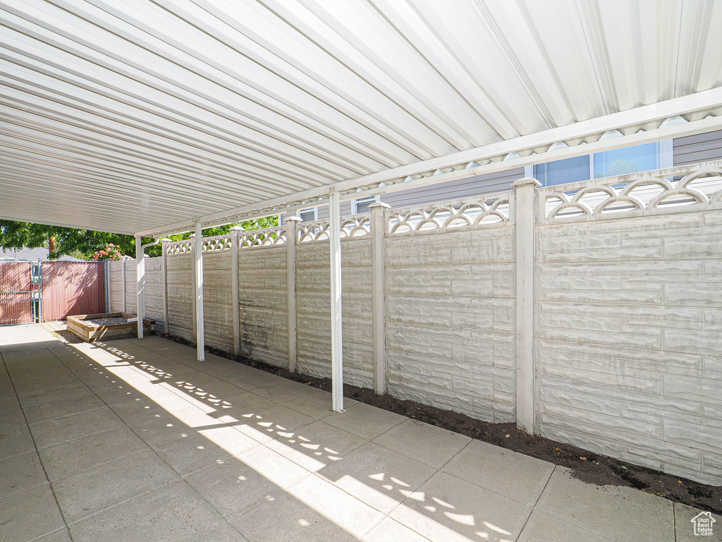 Fenced backyard with a patio