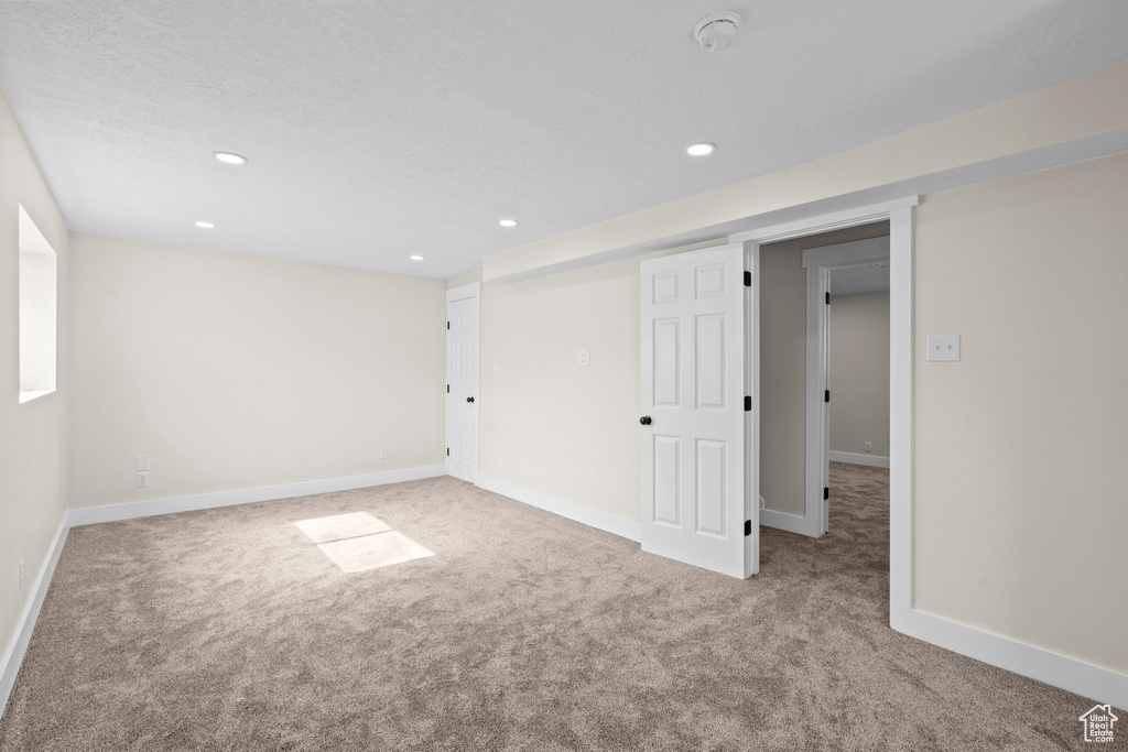 Unfurnished bedroom with carpet floors, recessed lighting, and baseboards