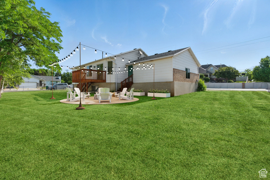 Rear view of property with a patio area, a deck, stairway, and brick siding