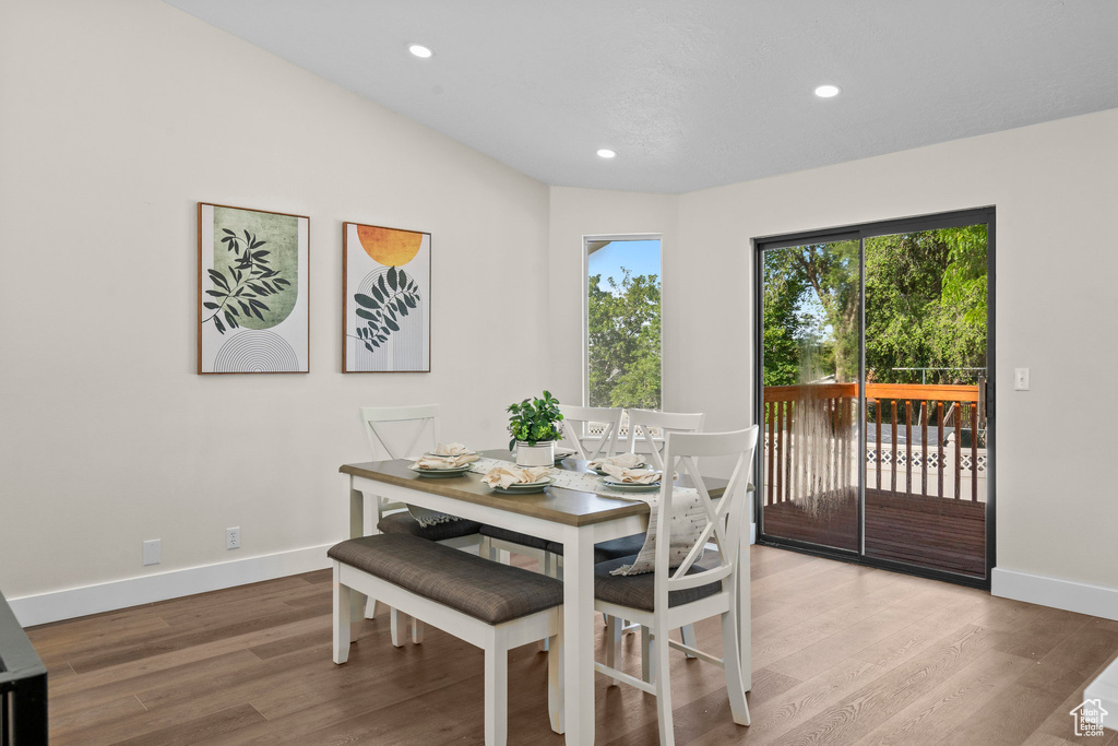 Dining space featuring wood finished floors, baseboards, and recessed lighting