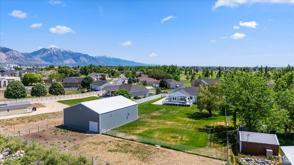 Aerial view of residential area featuring a mountainous background