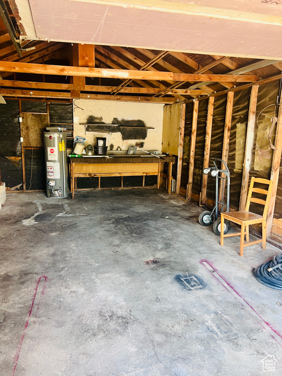 Garage featuring gas water heater