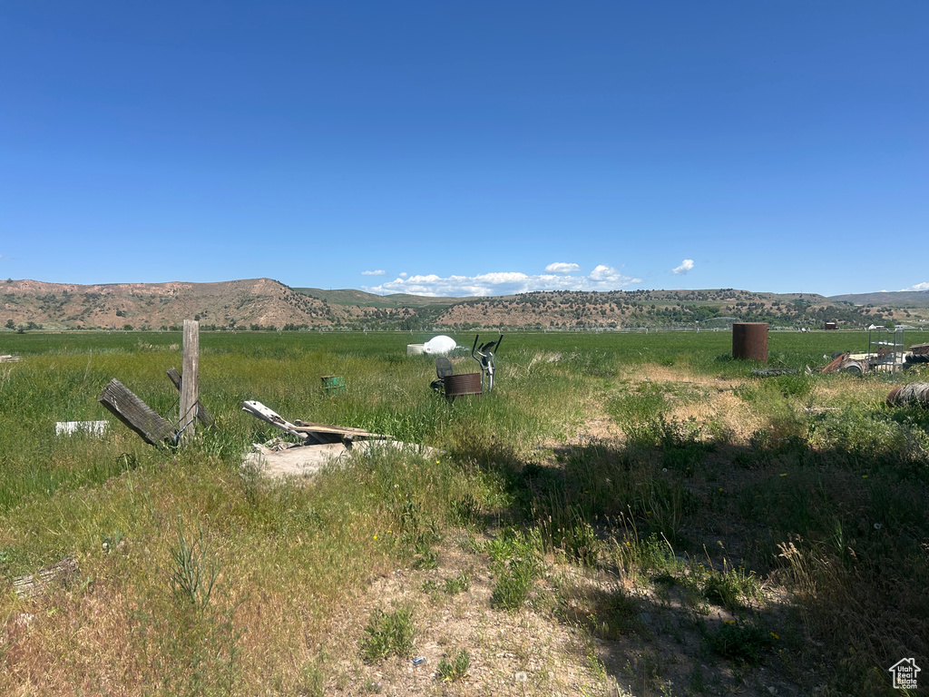 View of mountain backdrop with rural landscape