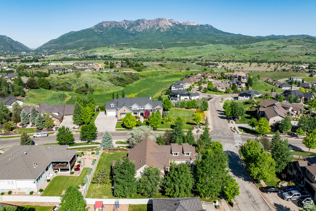Aerial perspective of suburban area featuring a mountainous background